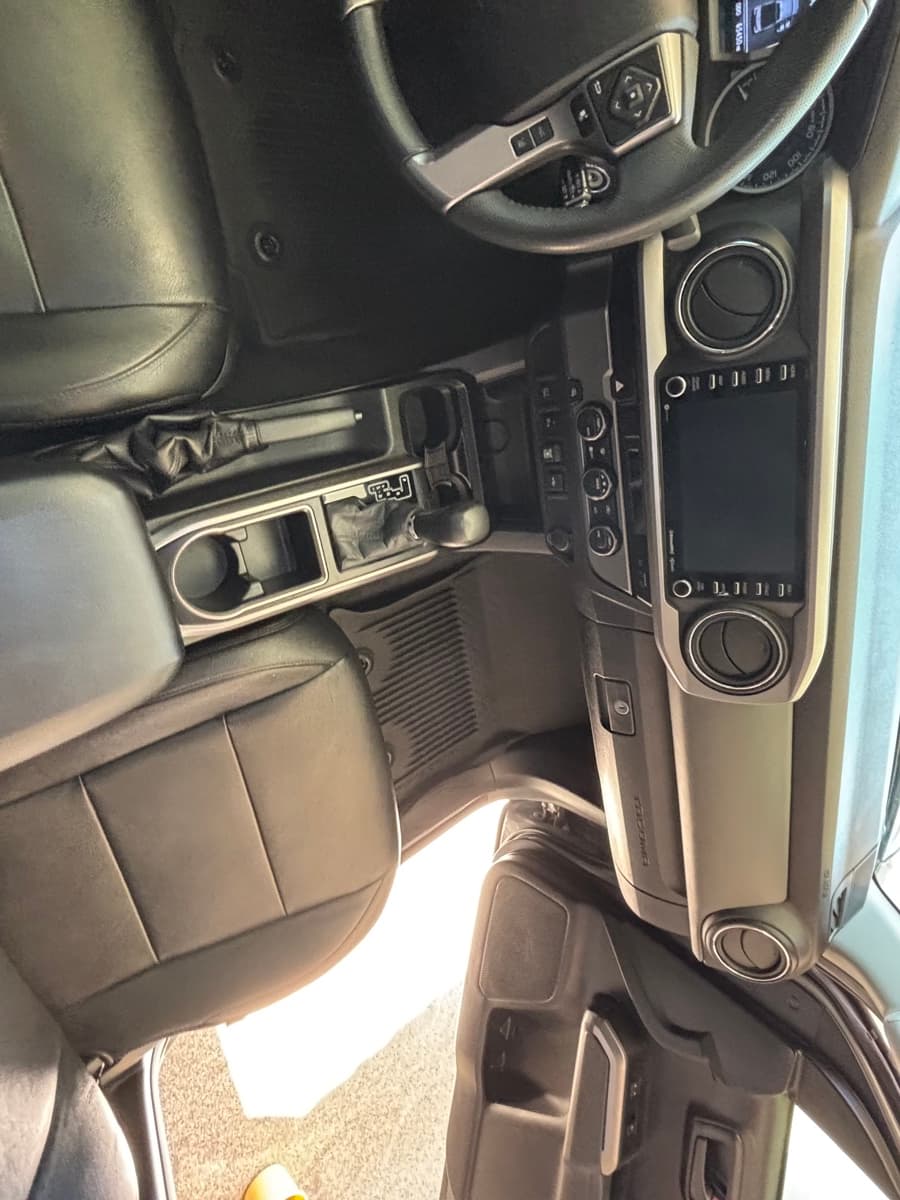 Cleaned dashboard and center console of a Toyota Tacoma